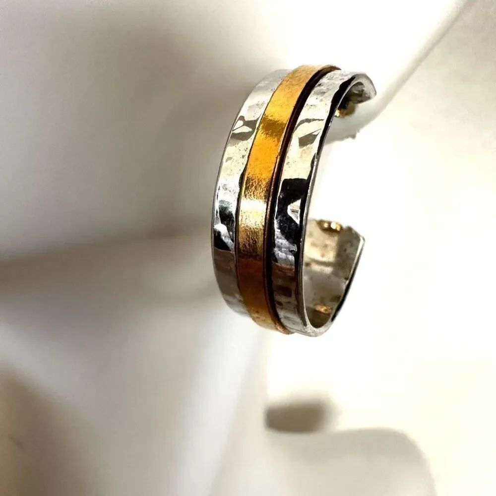 silver tone hoop earrings gold tone striped design